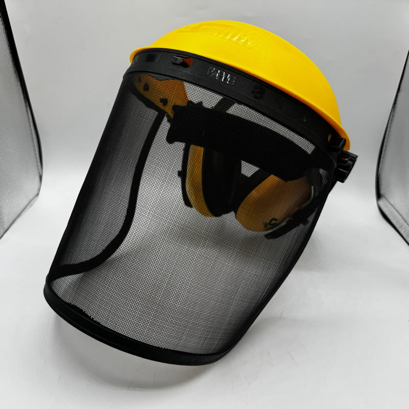 Mesh visor with yellow hard hat and earmuffs. Protective face shield.
