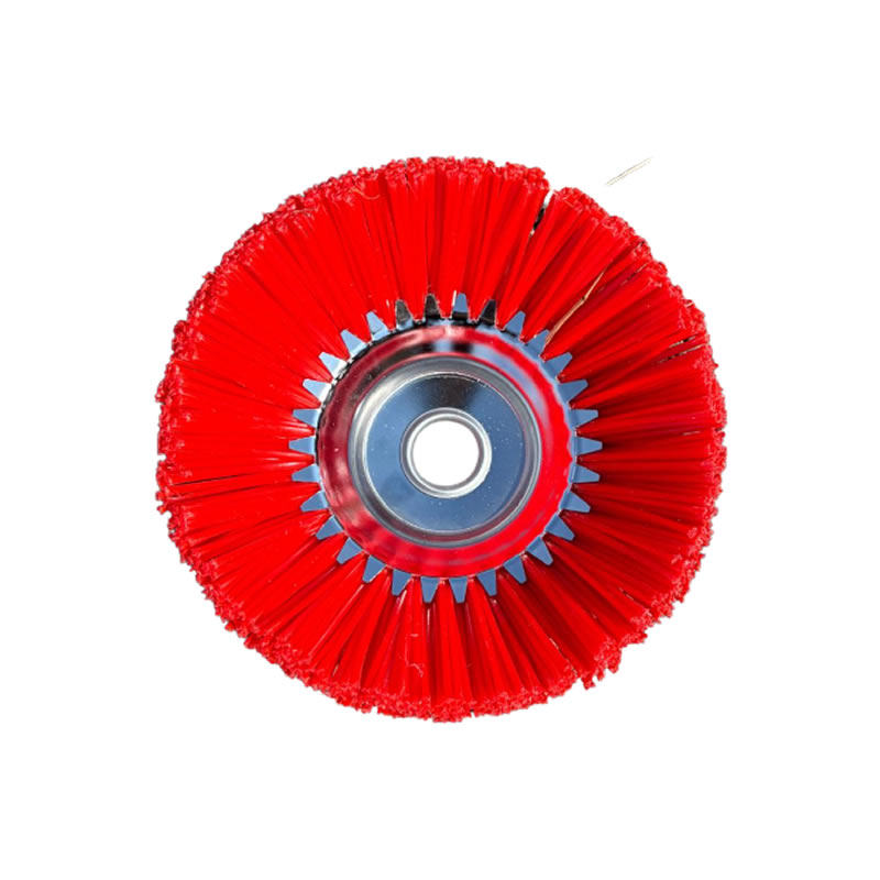 Single circular nylon brush with vibrant red bristles arranged around a metallic center hub, viewed top-down.